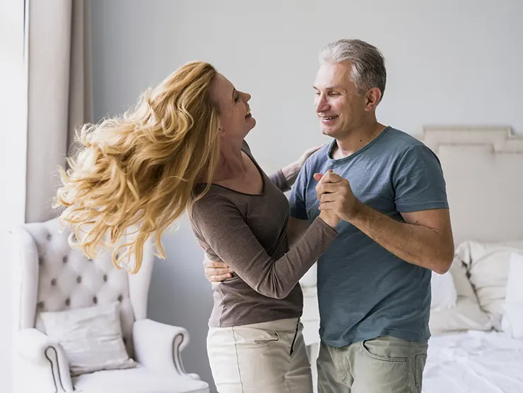 adorable senior man woman dancing together
